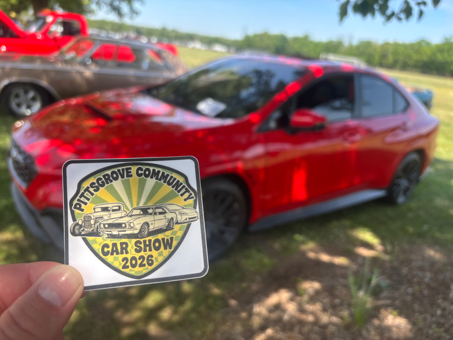 MZ-detailed red sedan at Pittsgrove Community Car Show 2026