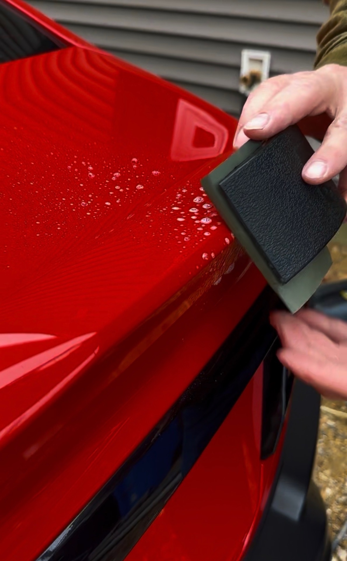 Hydrophobic ceramic beading on red sports car after paint correction — South Jersey detailing