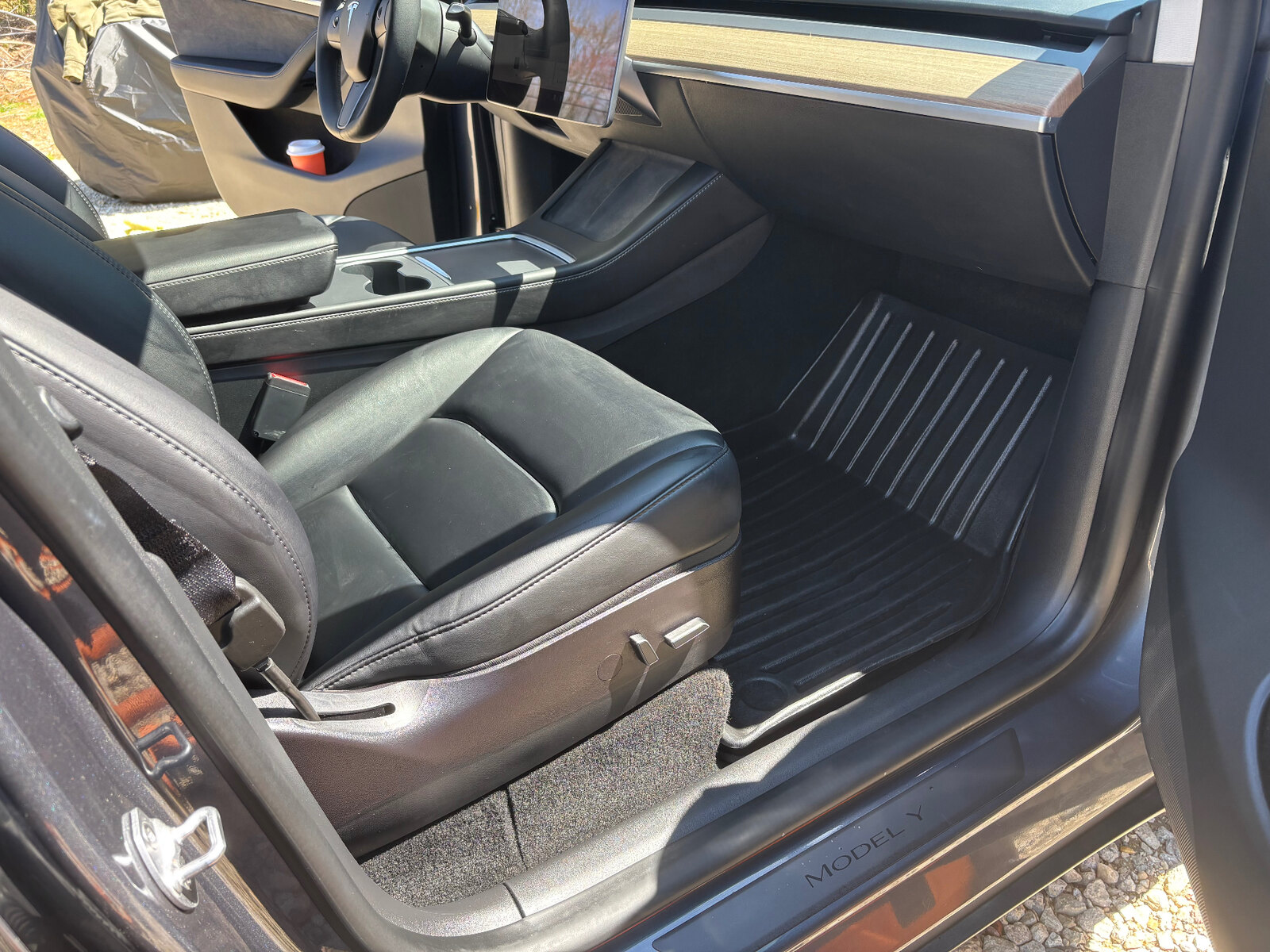 Tesla Model Y black interior — seats, console, and floor cleaned after interior detail