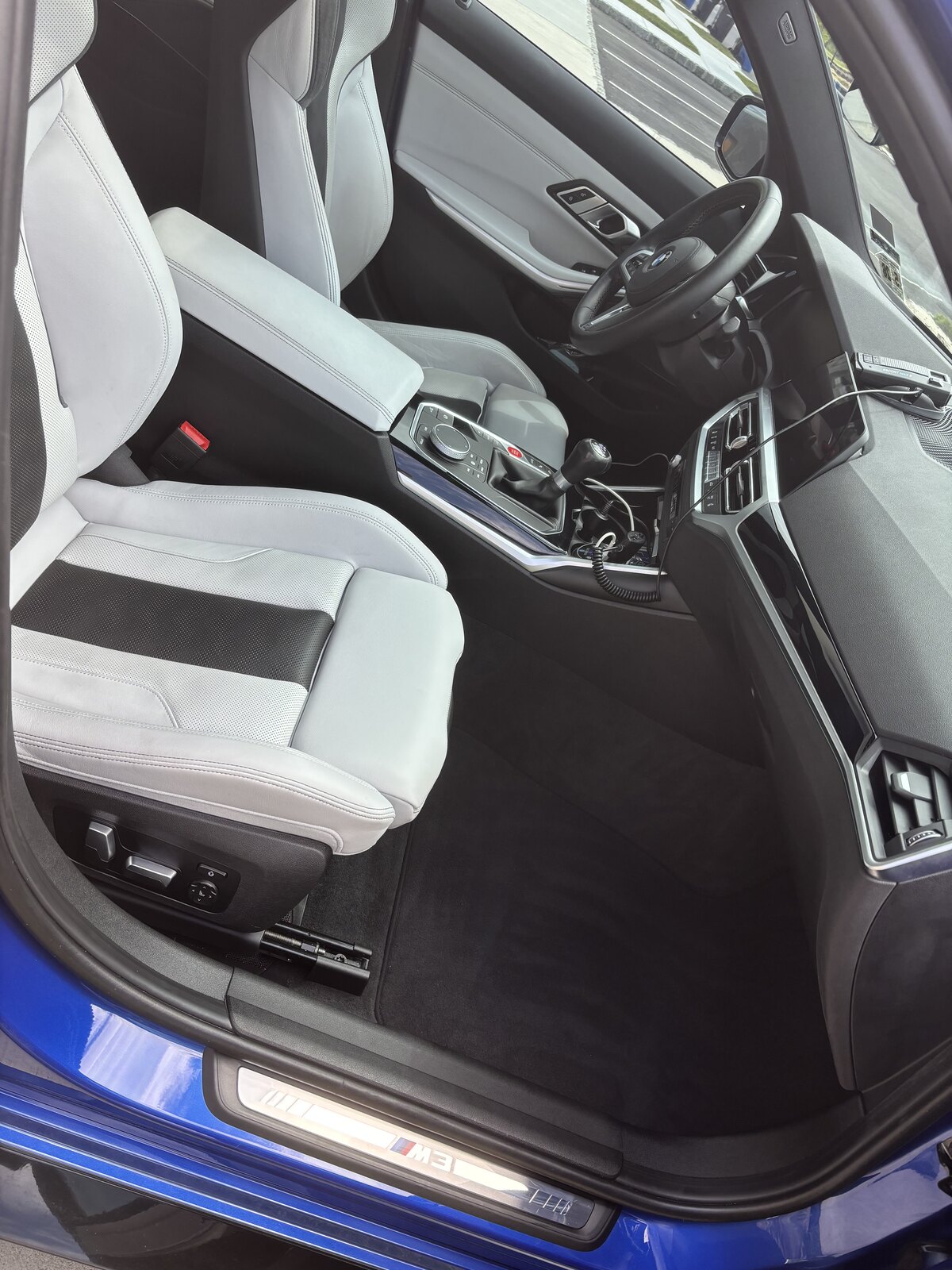 BMW M3 white leather sport seats and shifter after interior detail — mobile detailing NJ