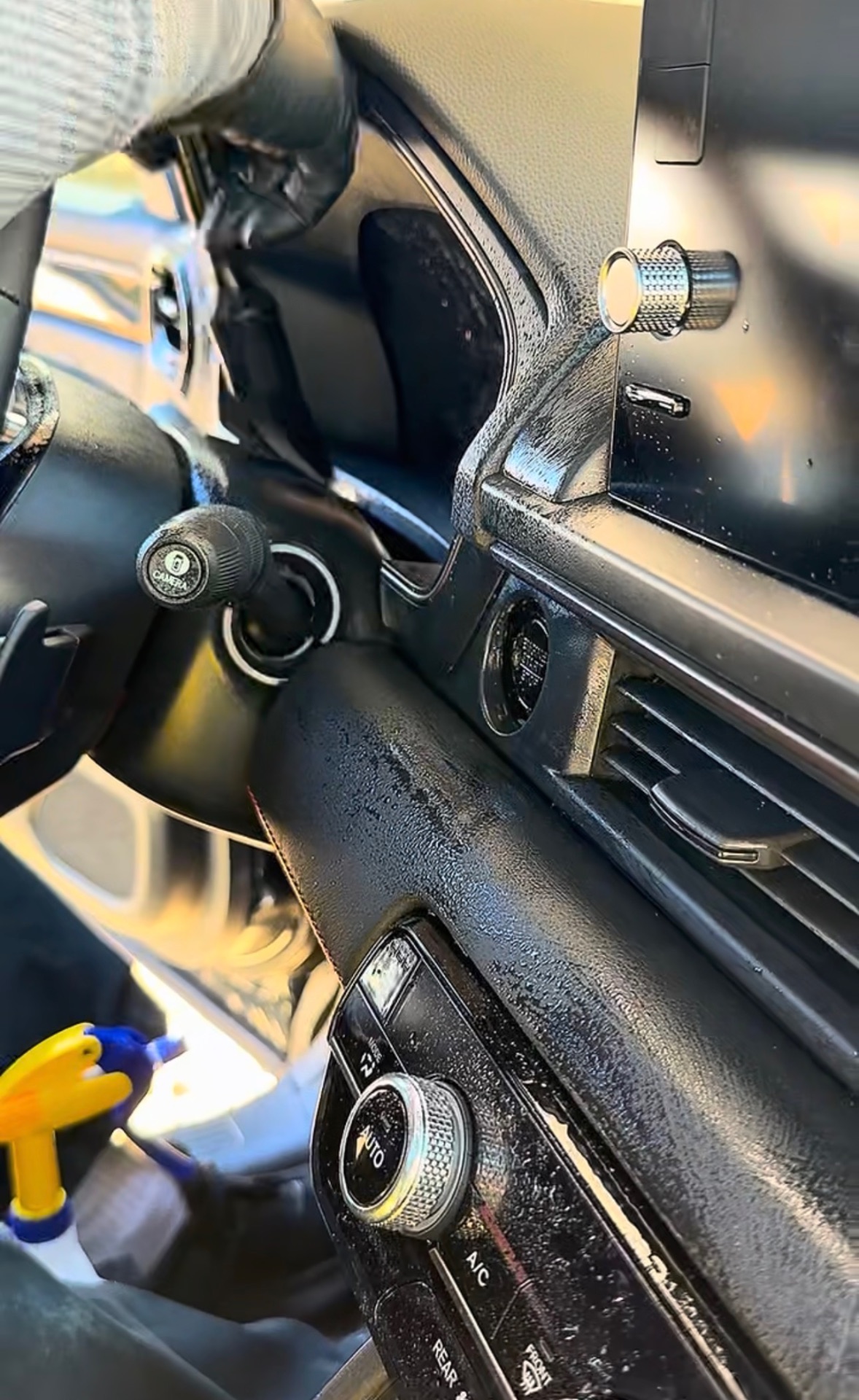Detailed dashboard, vents, and center console — interior detail close-up